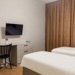 Bedroom with work area and TV in Apartment near Wawel in Krakow