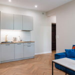 Kitchen counter with stools in Apartment near Main Market in Krakow